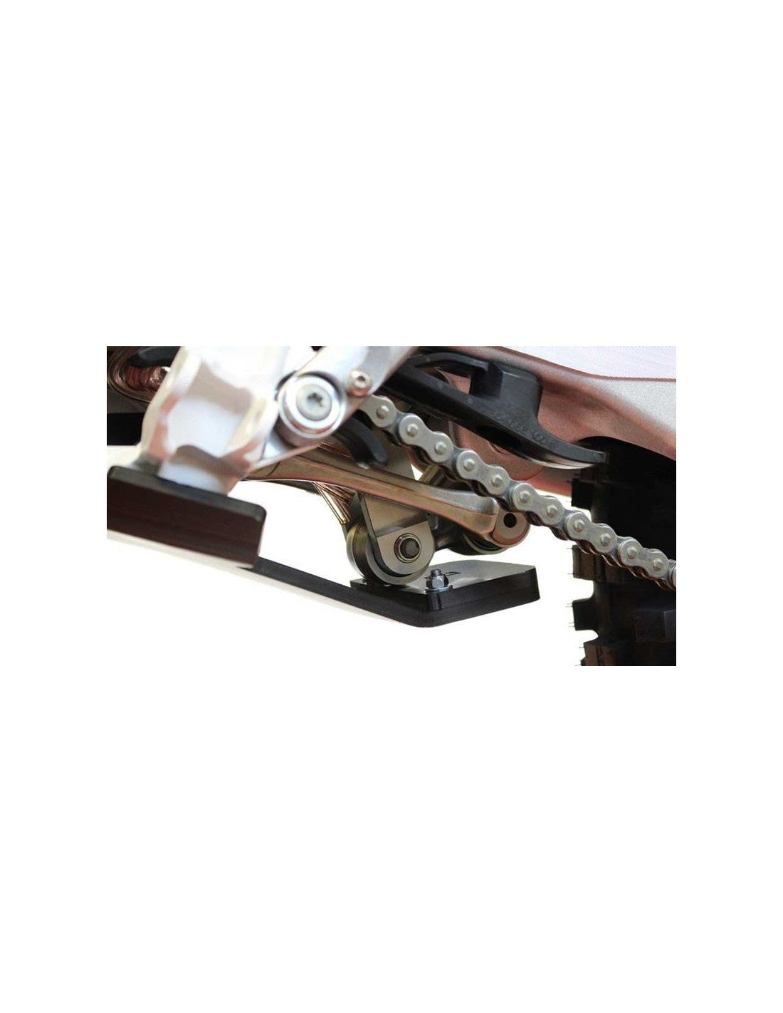 Close up view of the linkage guard of the black HDPE plastic skid plate for KTM - Husqvarna 125 / 150 2T