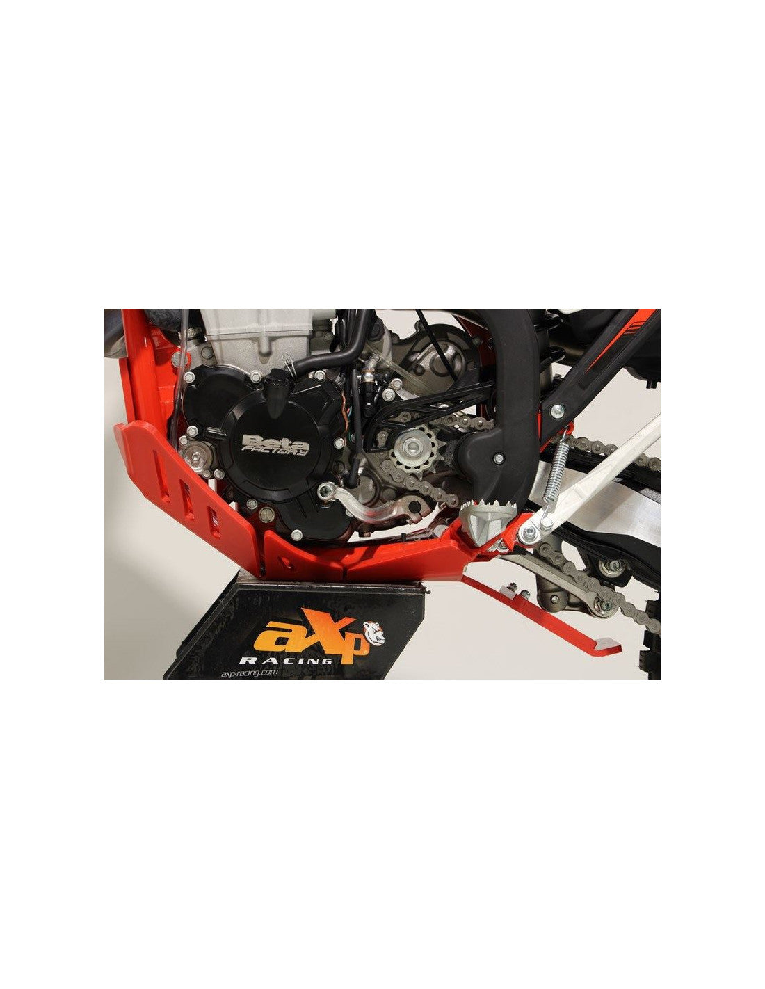 Left side of the red HDPE plastic skid plate with linkage guard for Beta enduro 4T