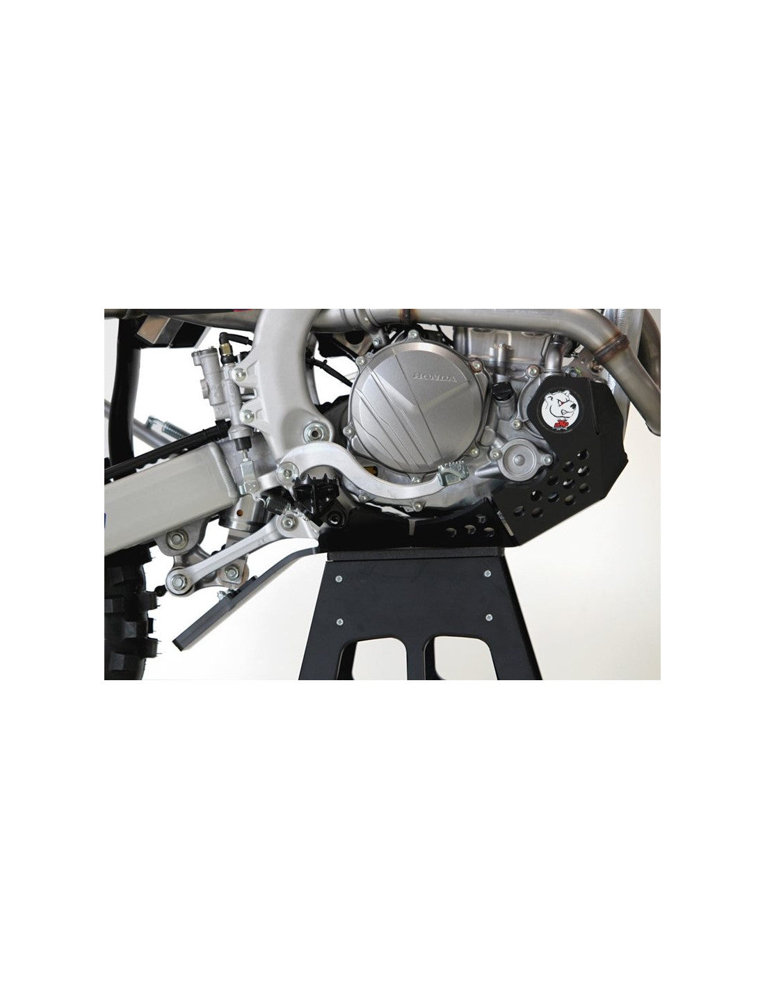 Right side of the red HDPE plastic skid plate with linkage guard for Honda CRF250 and 300