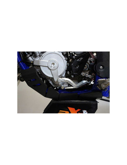 Side view of the black HDPE plastic skid plate with linkage guard for Sherco 125SER