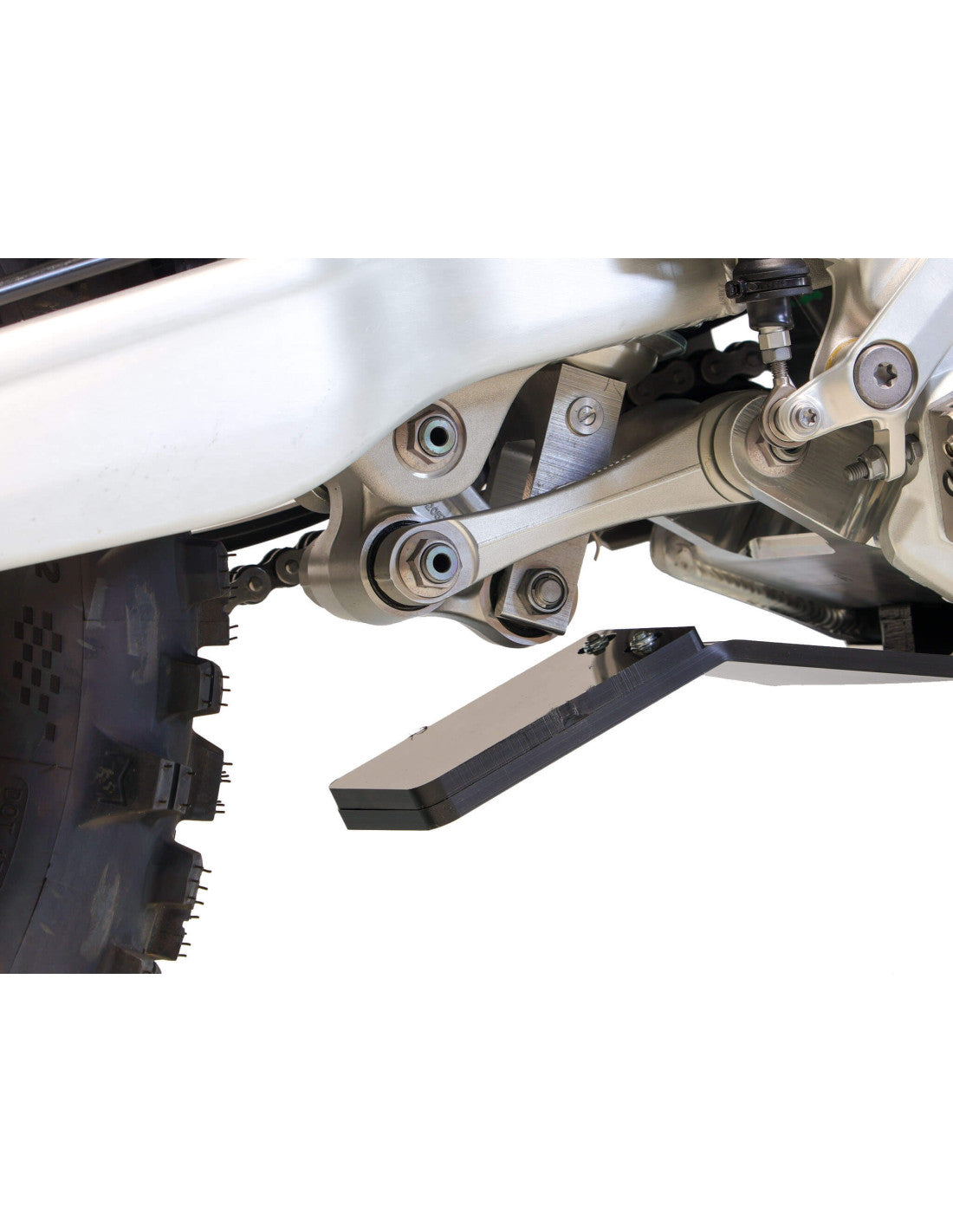 Close up view of the linkage guard of the black HDPE plastic skid plate for Triumph TF450-RC and TF450-E