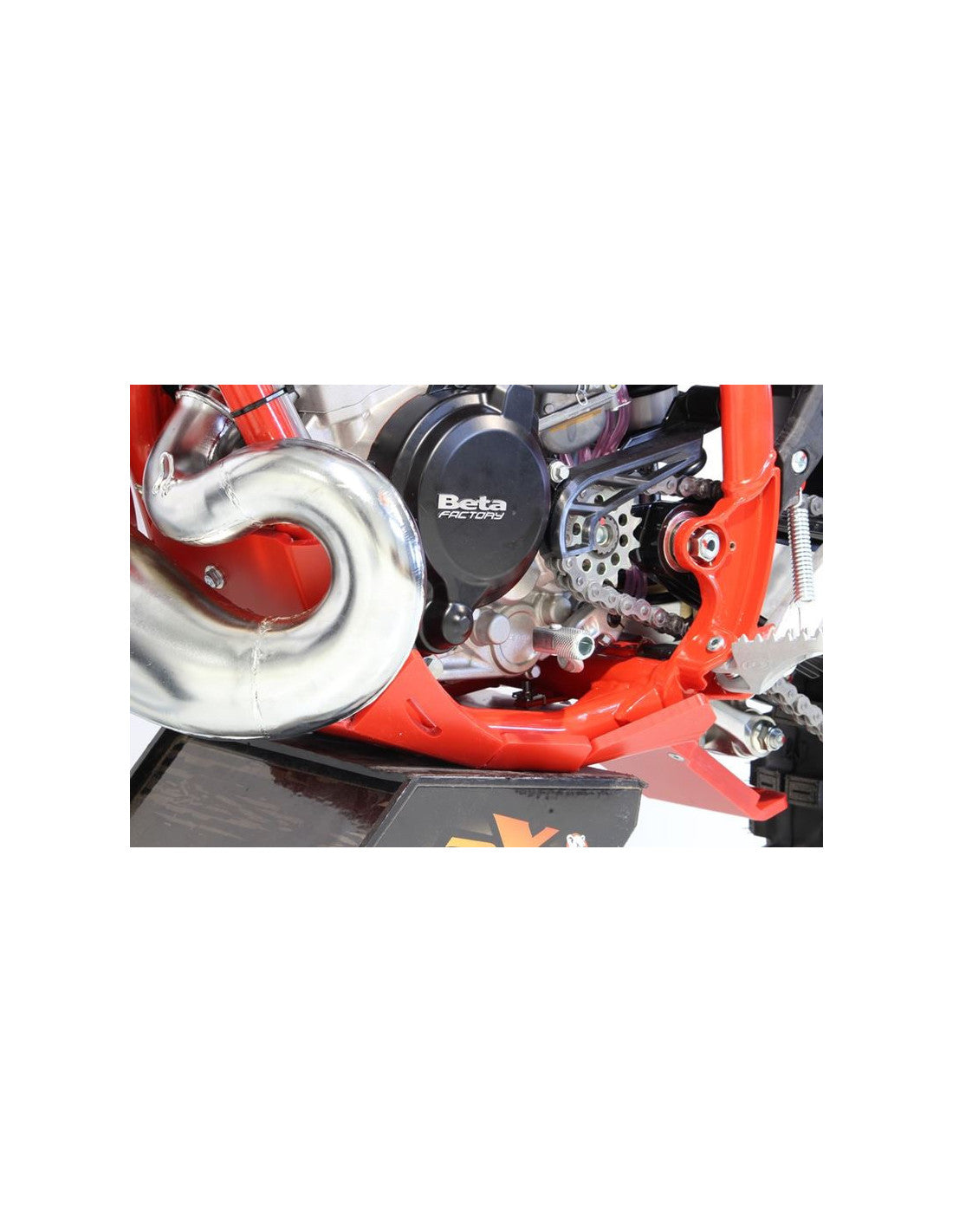 Left side of the red HDPE plastic skid plate with linkage guard for Beta 125RR - 200RR