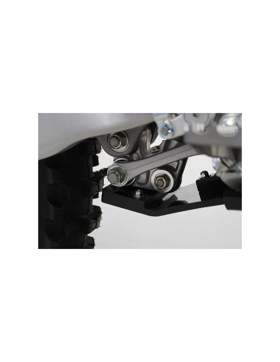 Close up view of the linkage guard of the black HDPE plastic skid plate for Yamaha YZ250F - YZ450F
